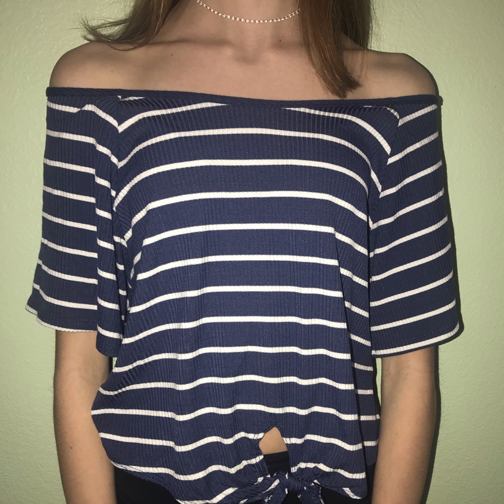 Off the shoulder striped dress shirt.